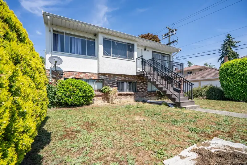 1987 E 61ST AVENUE - photo 1 of 34