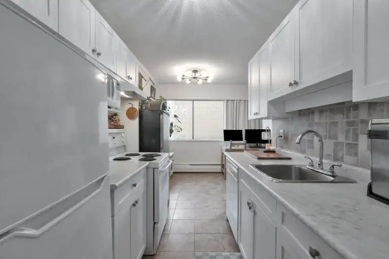 103 214 E 15TH STREET - photo 1 of 27